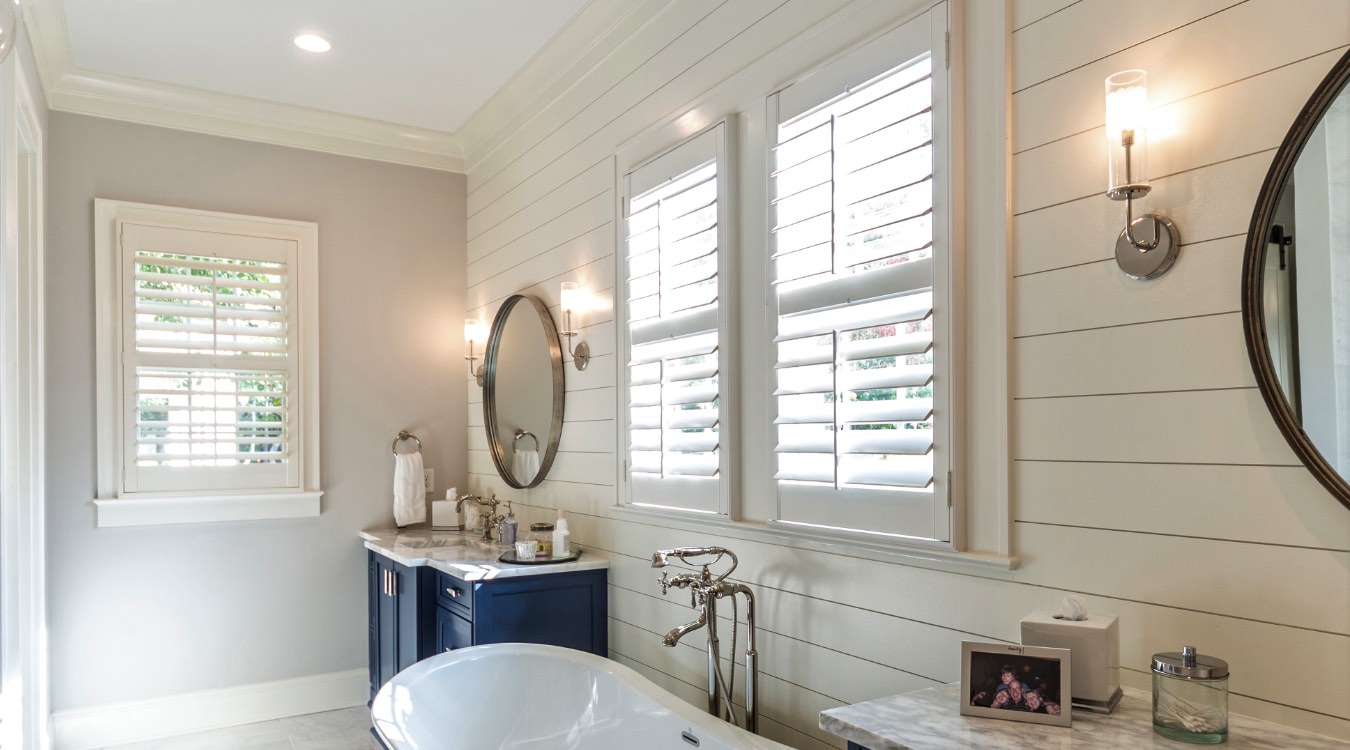 Bluff City bathroom with white plantation shutters.
