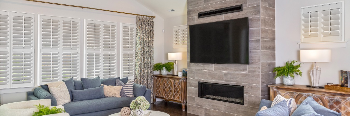Plantation shutters in Bristol family room with fireplace