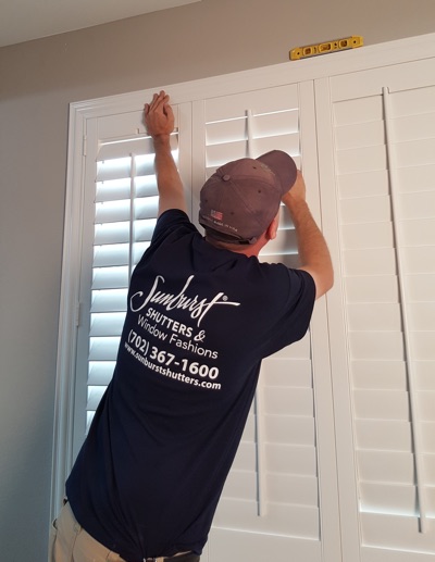 Shutter installation in Bluff City bedroom.