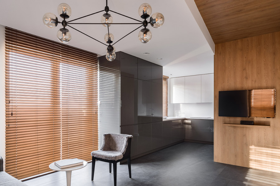 Brown wood blinds on a large window in a modern home