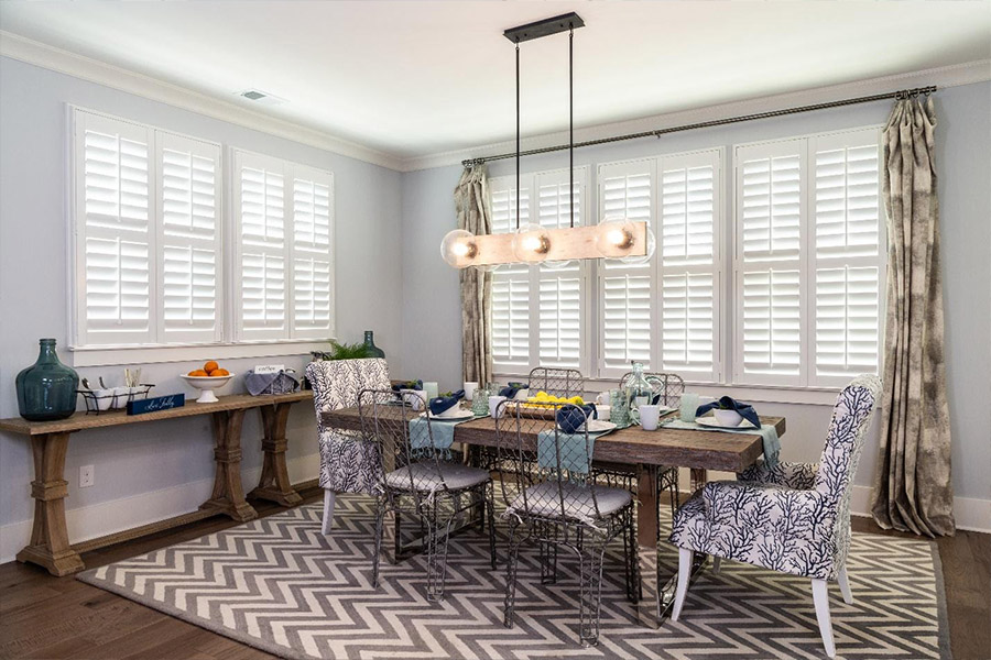 White polywood shutters inside a dining room