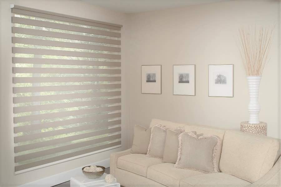 Zebra shades give you a unique combination of light control and style that benefits your Bluff City home. Zebra shade allows filtered light into a living room