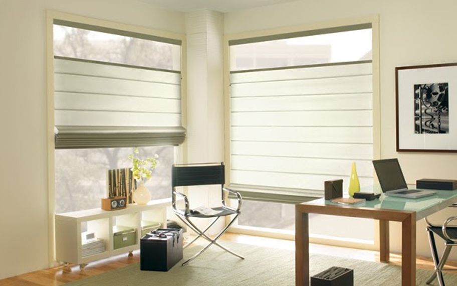 Upgrade your windows with stylish window shades or shutters in Bluff City. Stylish sheer shades in the corner of a modern office.
