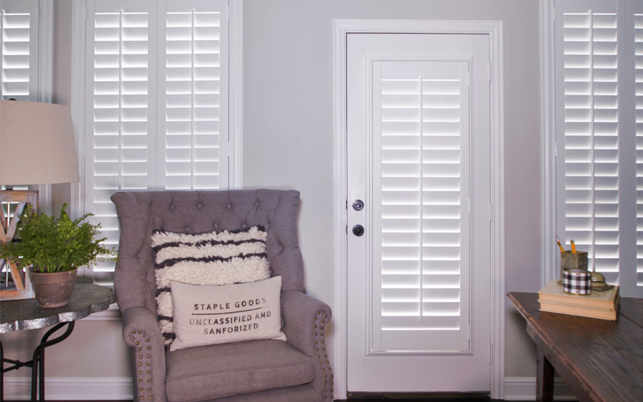 Interior shutters are beautiful and durable window treatments for glass doors in Bluff City. Polywood shutters on a door